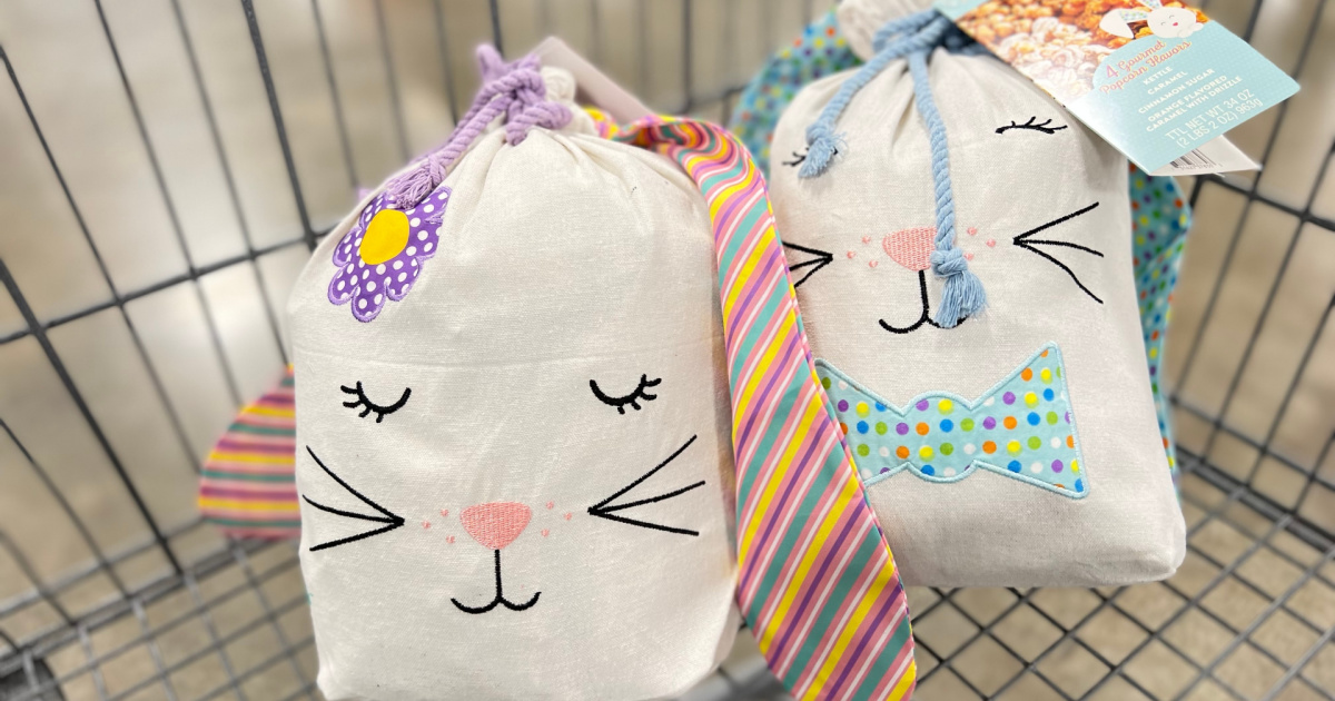 two Easter Bunny sacks filled with popcorn in store cart