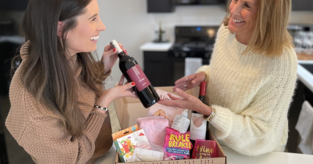 two women in kitchen with wine subscription box
