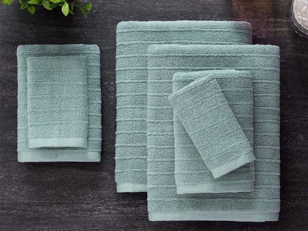 mineral colored towels stacked on counter
