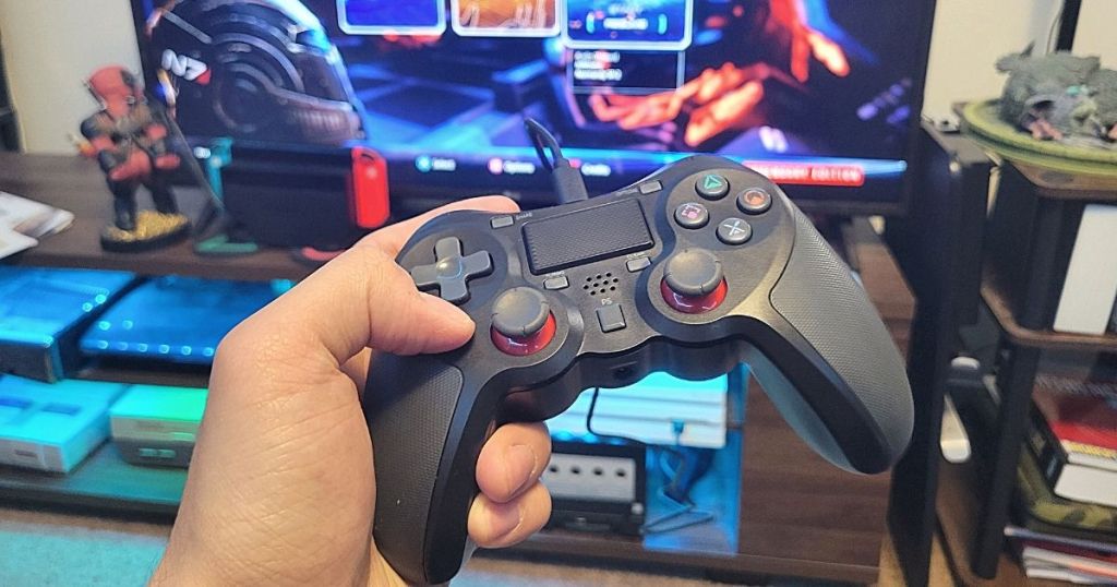 hand holding Terios Wireless Pro Controller