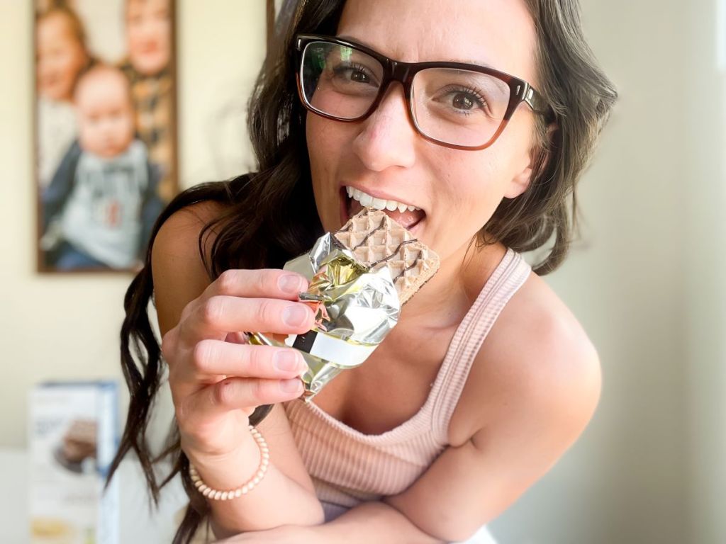 woman eating a snack bar