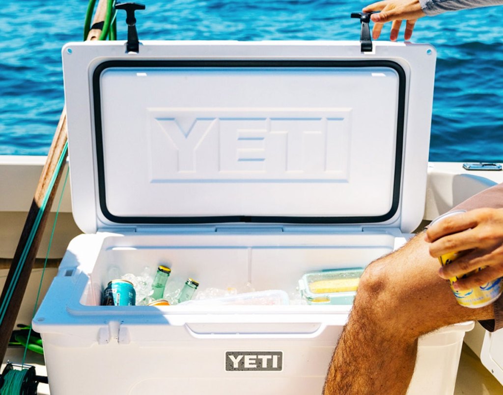 opened white yeti cooler on a boat