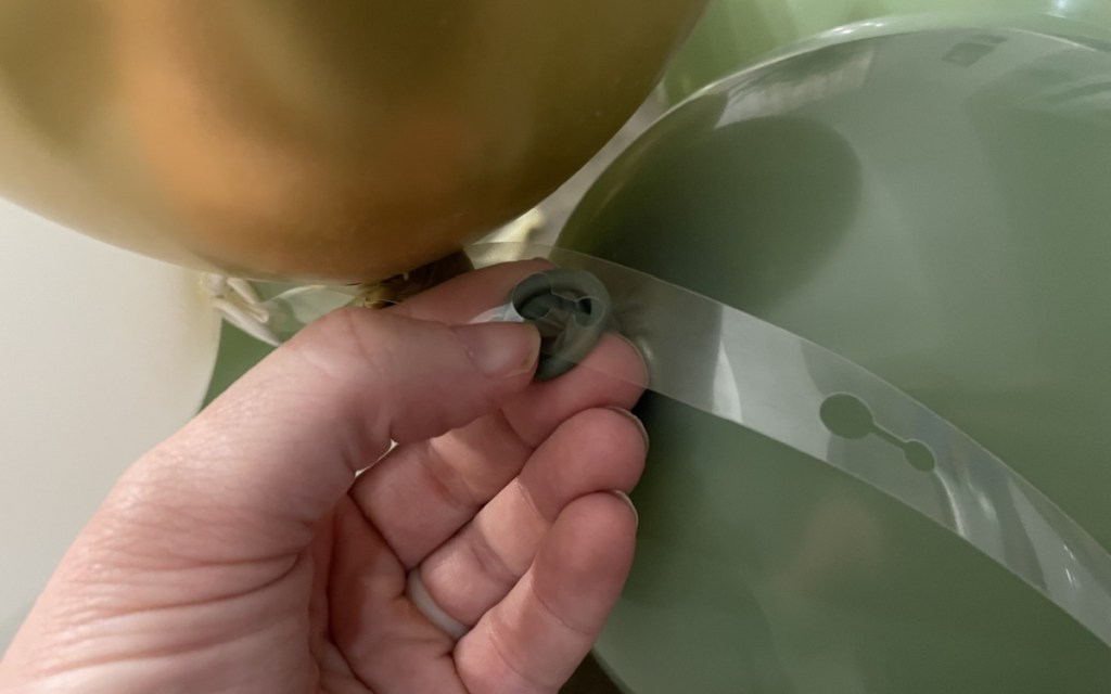 inserting balloon in garland strip