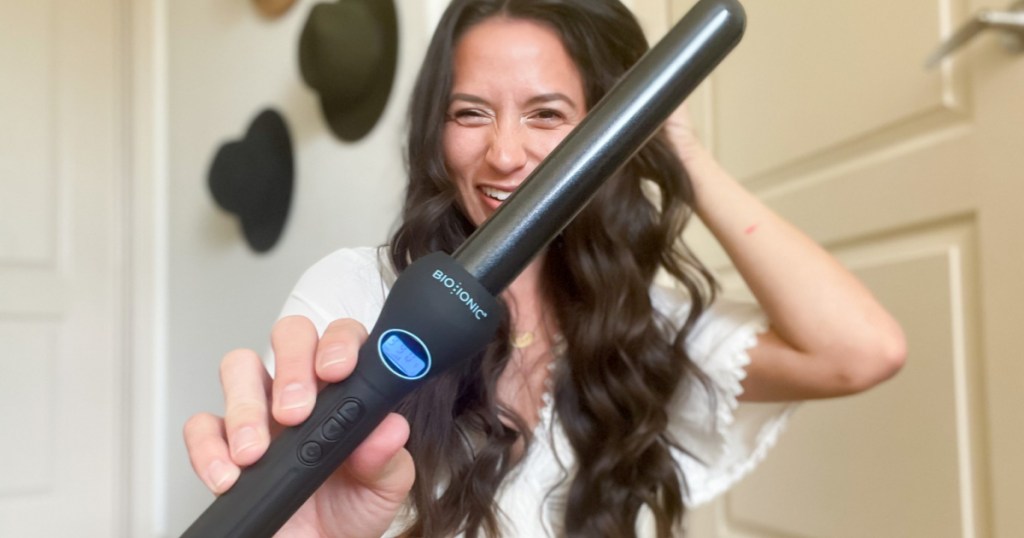 woman holding curling wand