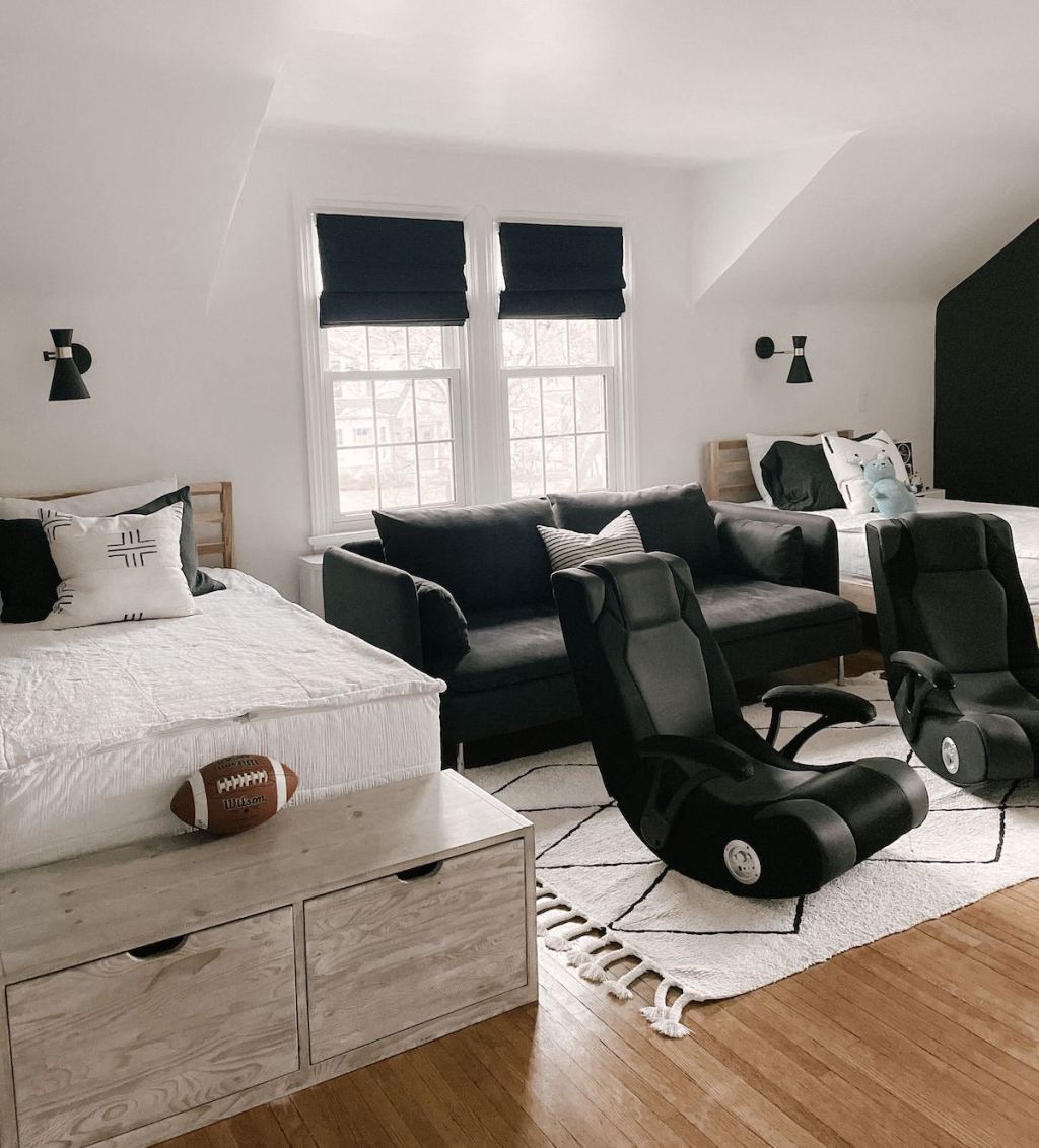 boys room with roman shades gaming chairs and matching white and black beds
