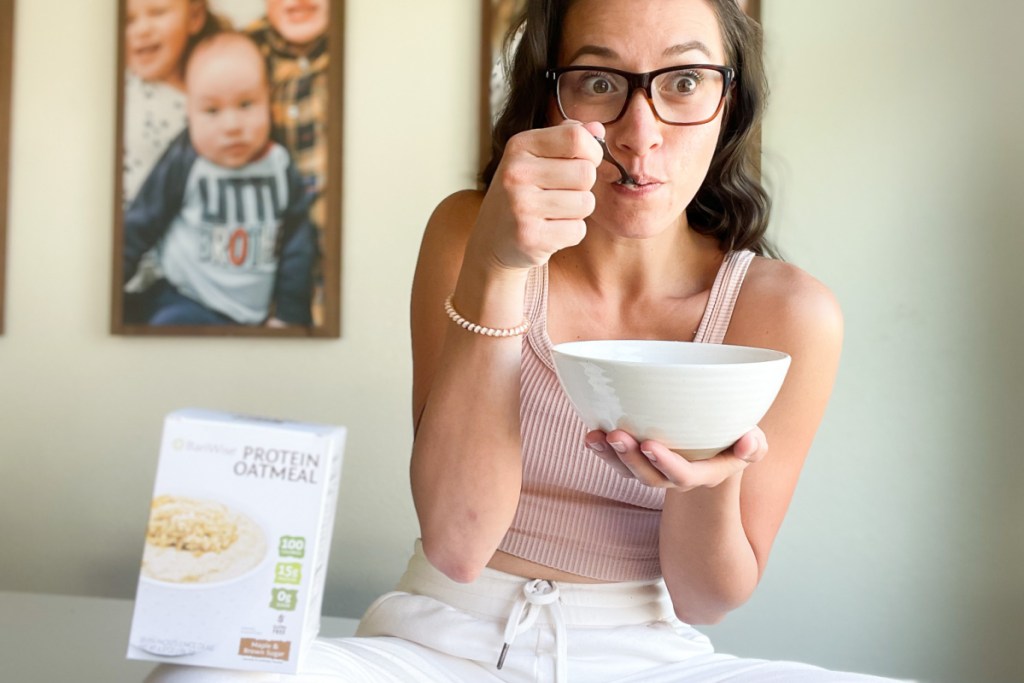woman eating bowl of oatmeal
