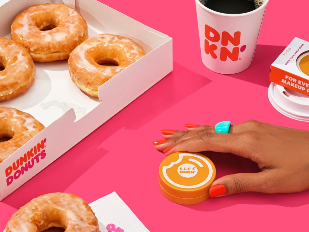 holding makeup with Dunkin' donuts