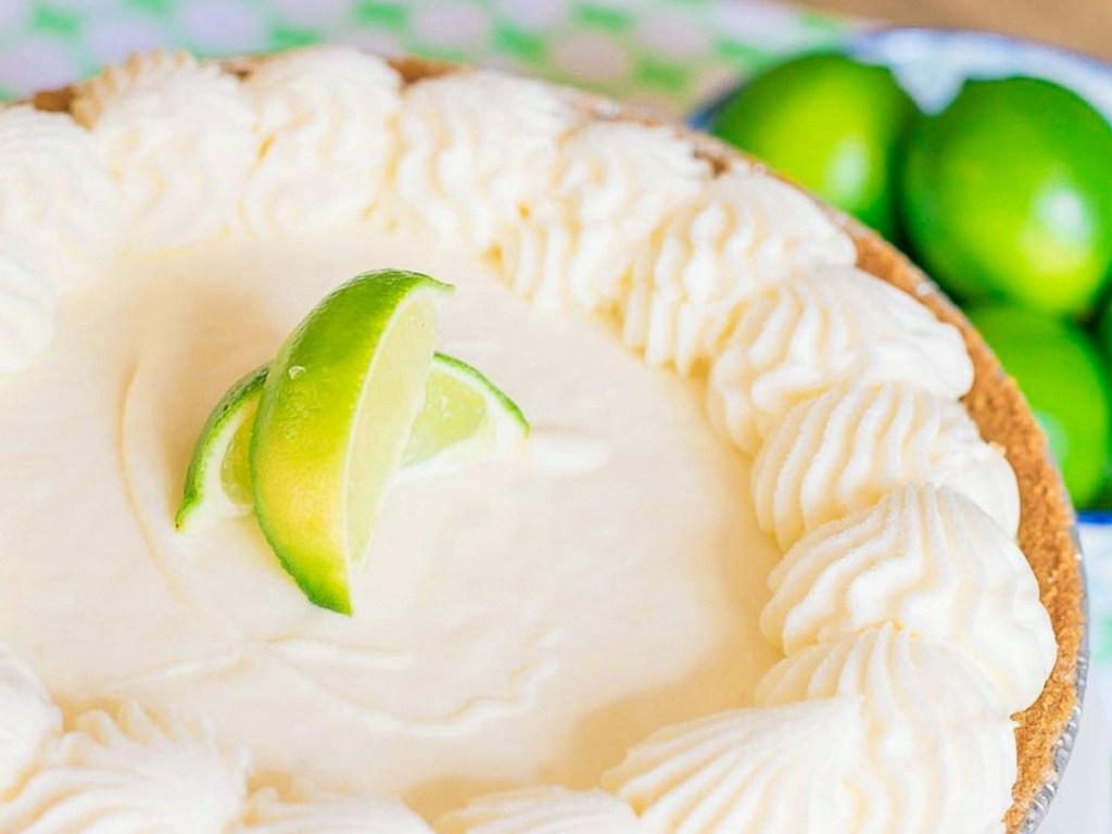 Key Lime pie next to fresh limes