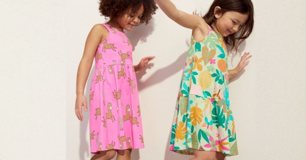 Two girls wearing dresses