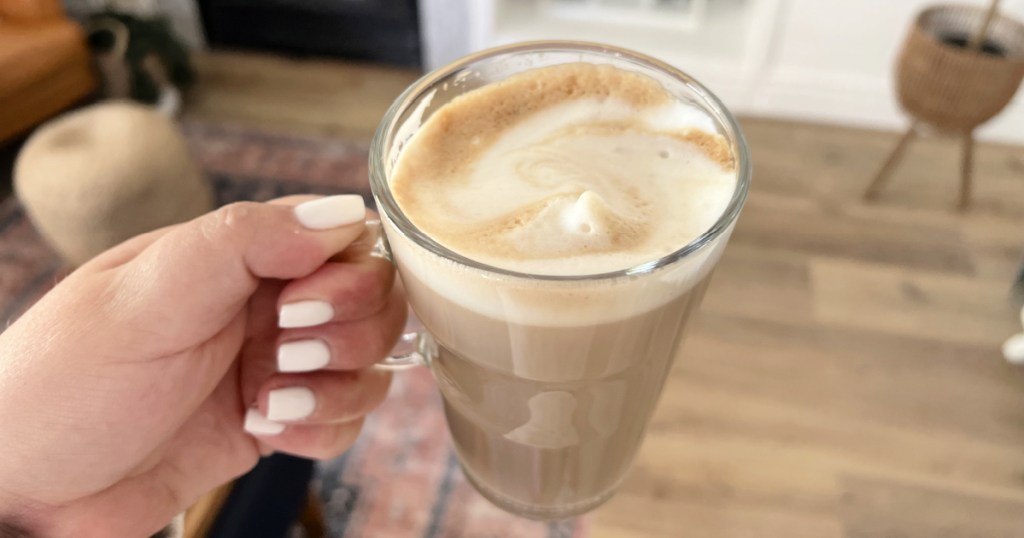 holding a homemade latte