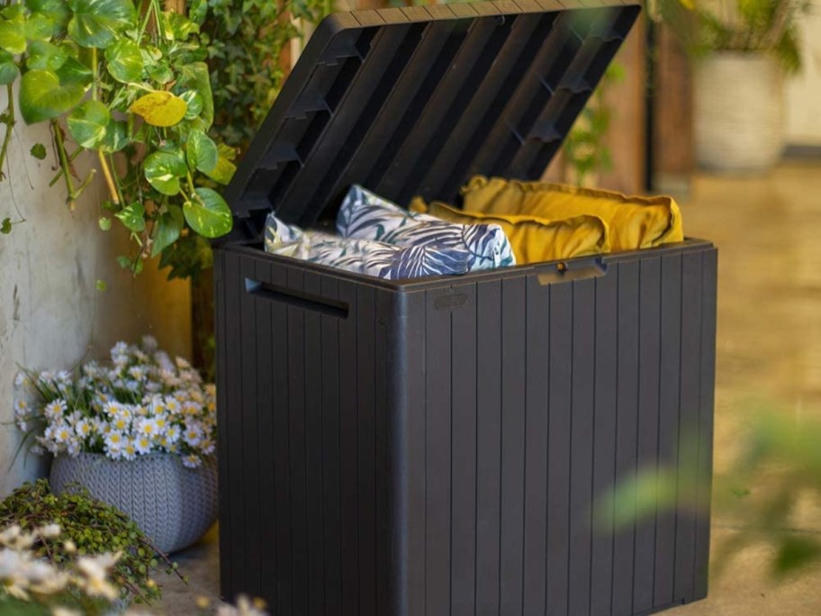 open deck storage box with pillows inside