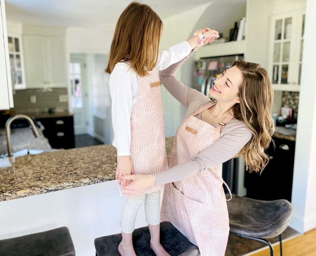 mom and daughter standing in kitchen
