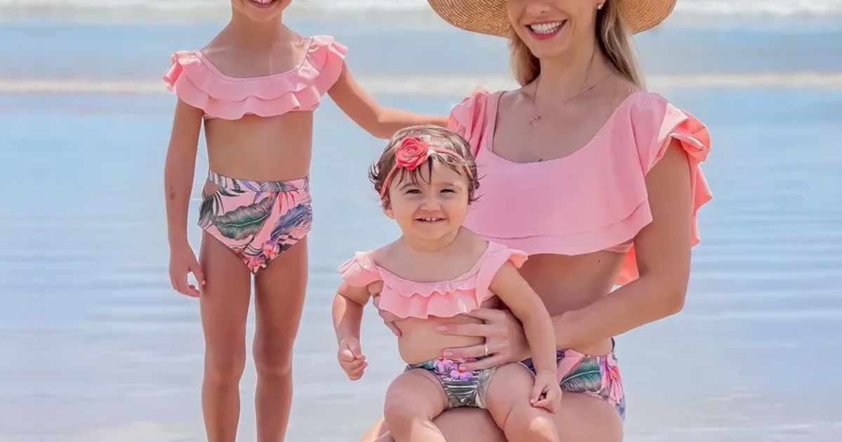 mom and daughters in matching swimwear