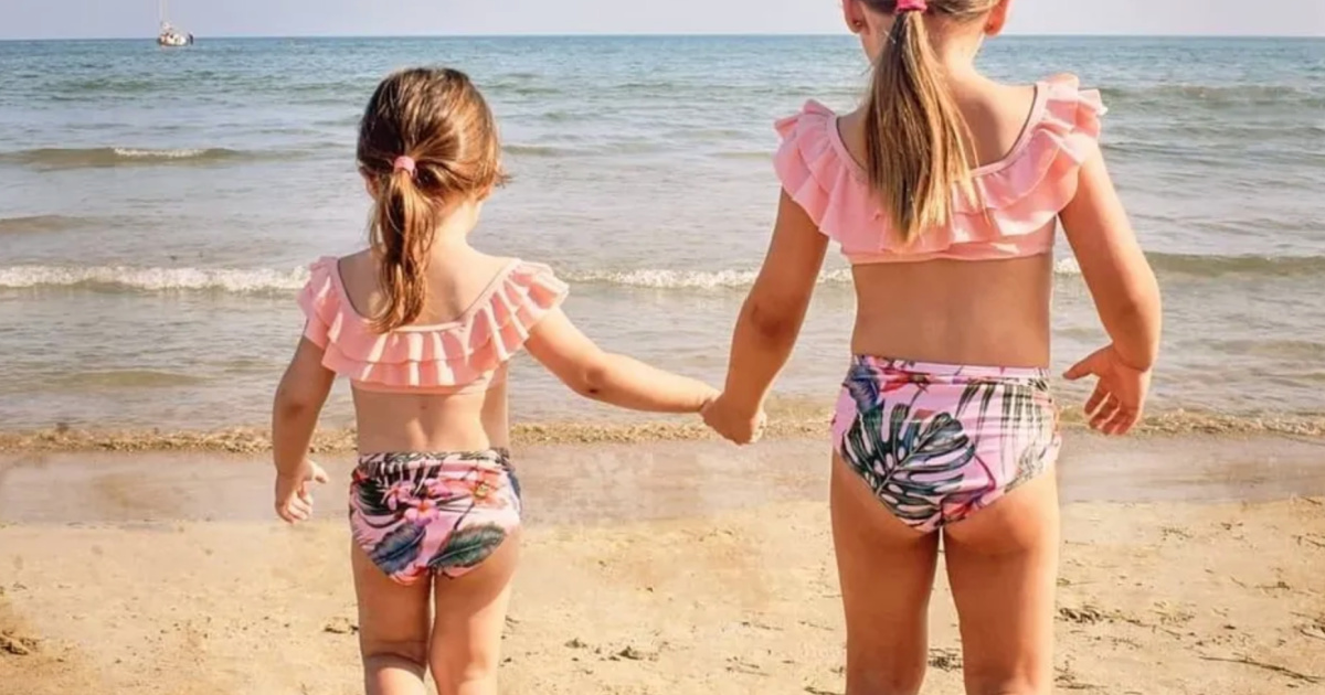 two girls wearing bathing suits