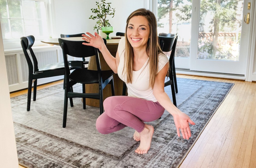 woman with hands out showing off ruggable rug coupon