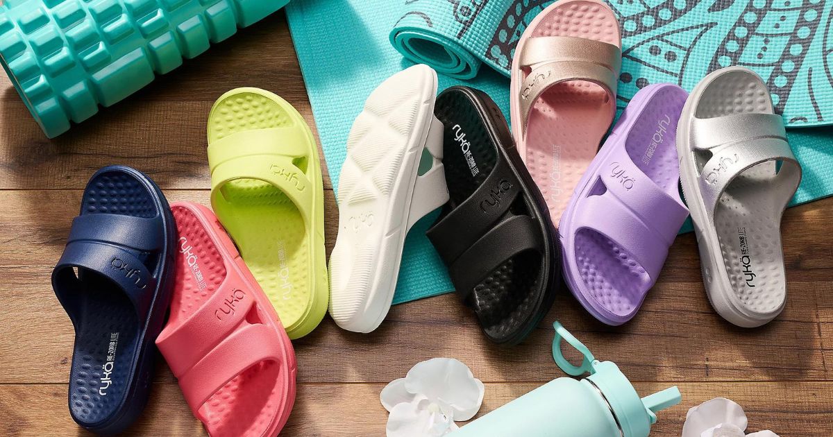 multiple colors of Ryka slides sandals on floor