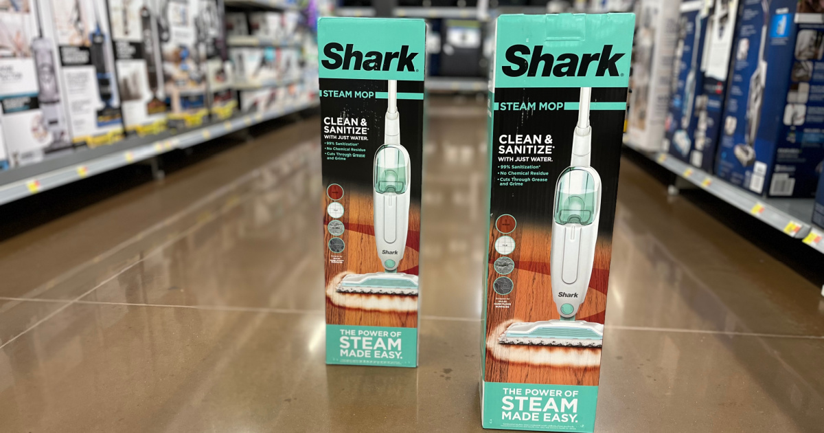 two boxes of shark steam mop on floor in store
