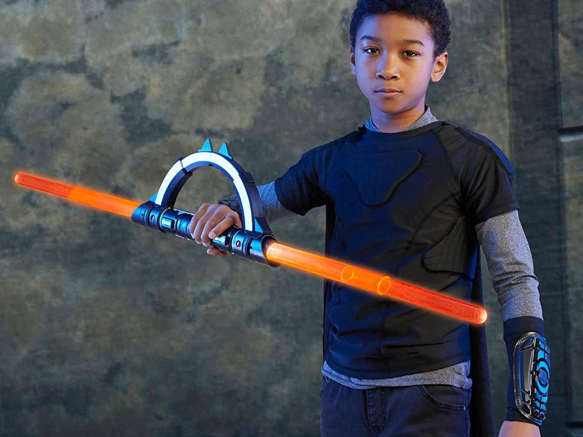 child playing wtih star wars lightsaber