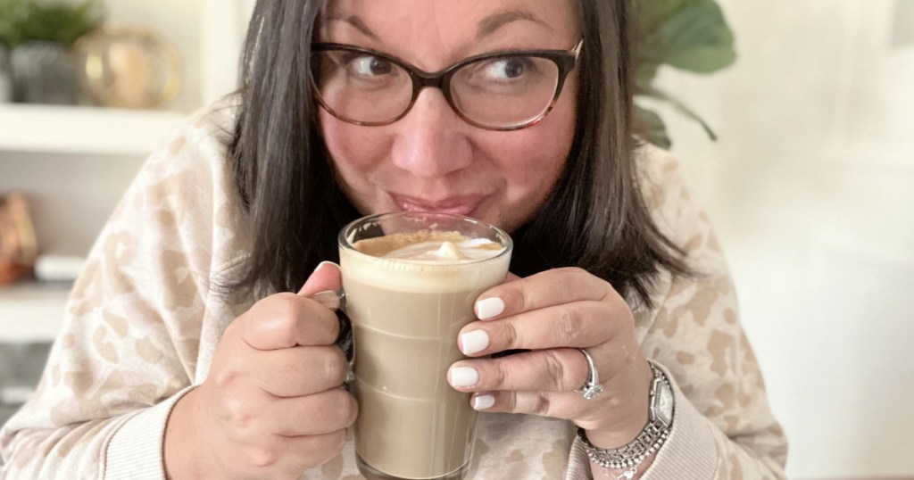 woman drinking a latte