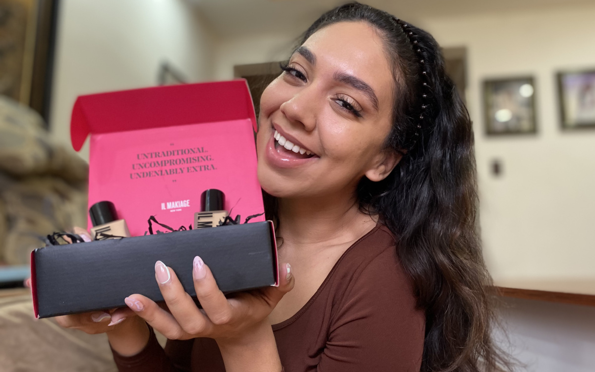 woman holding a box of full coverage makeup