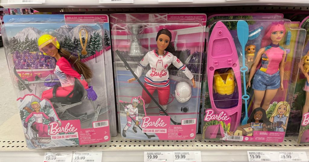 barbie dolls on shelf 