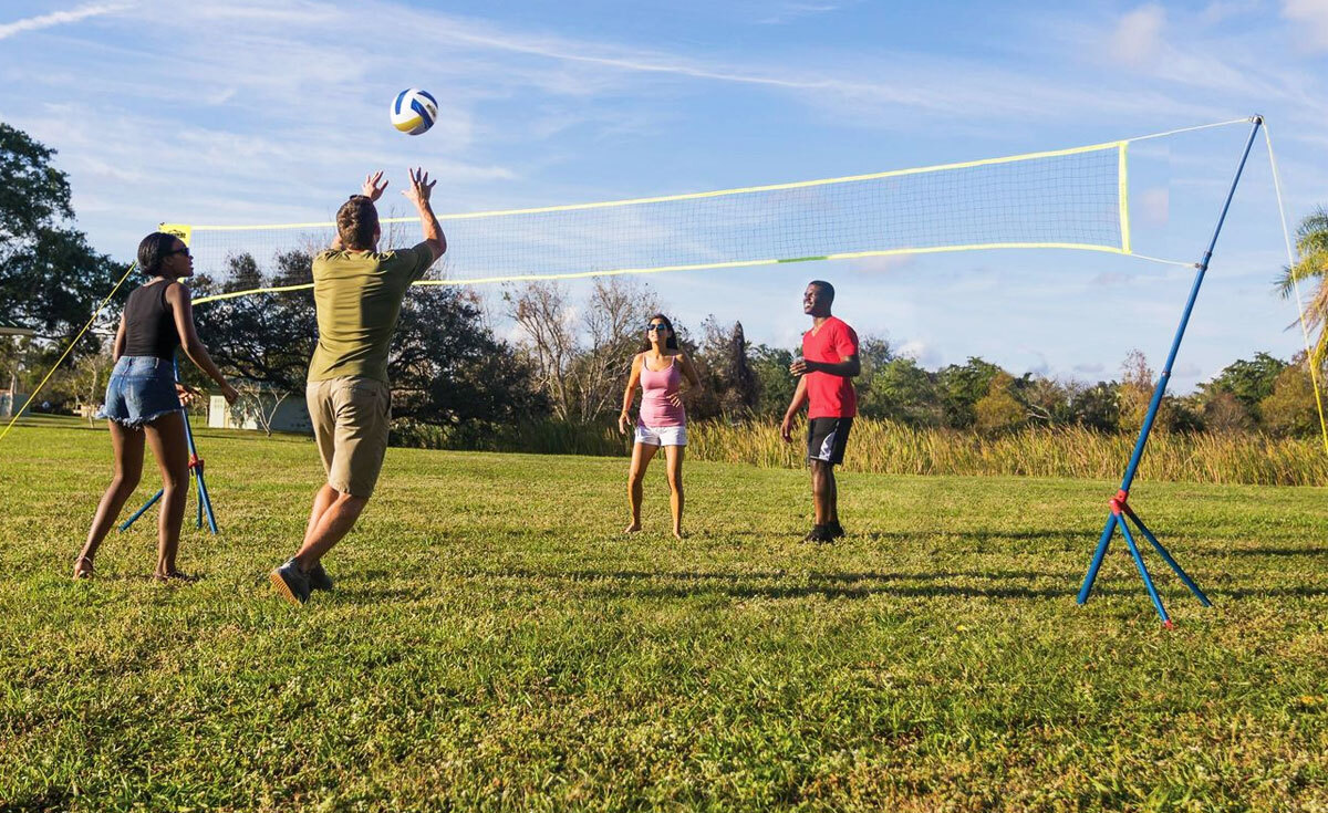 people playing Volleyball in yard