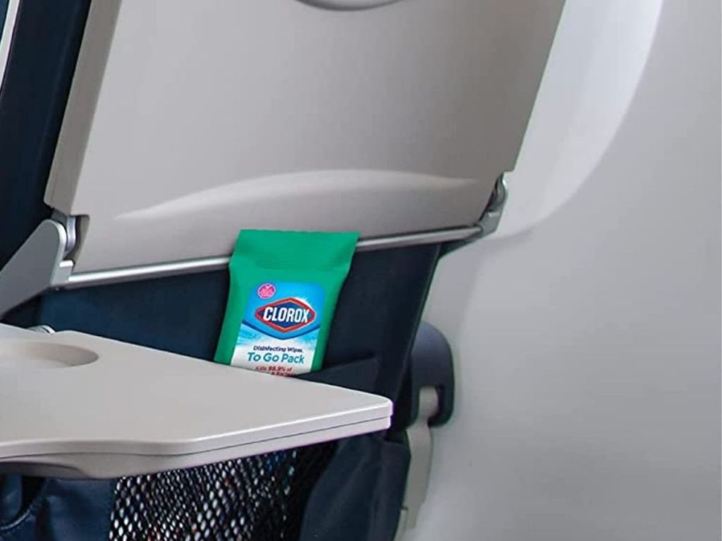Clorox Disinfecting On The Go Travel Wipes on back of airplane seat