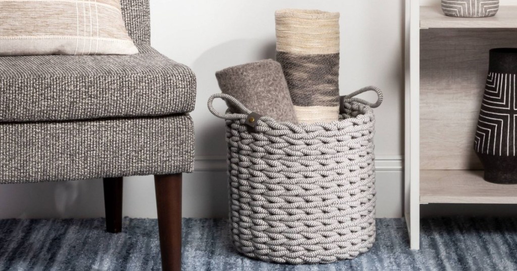Coiled rope basket next to chair