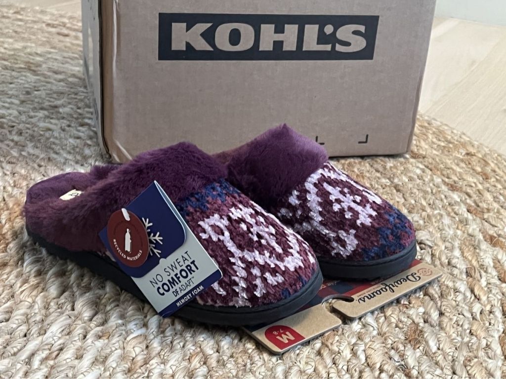 Dearfoams purple and blue slippers in front of Kohl's box