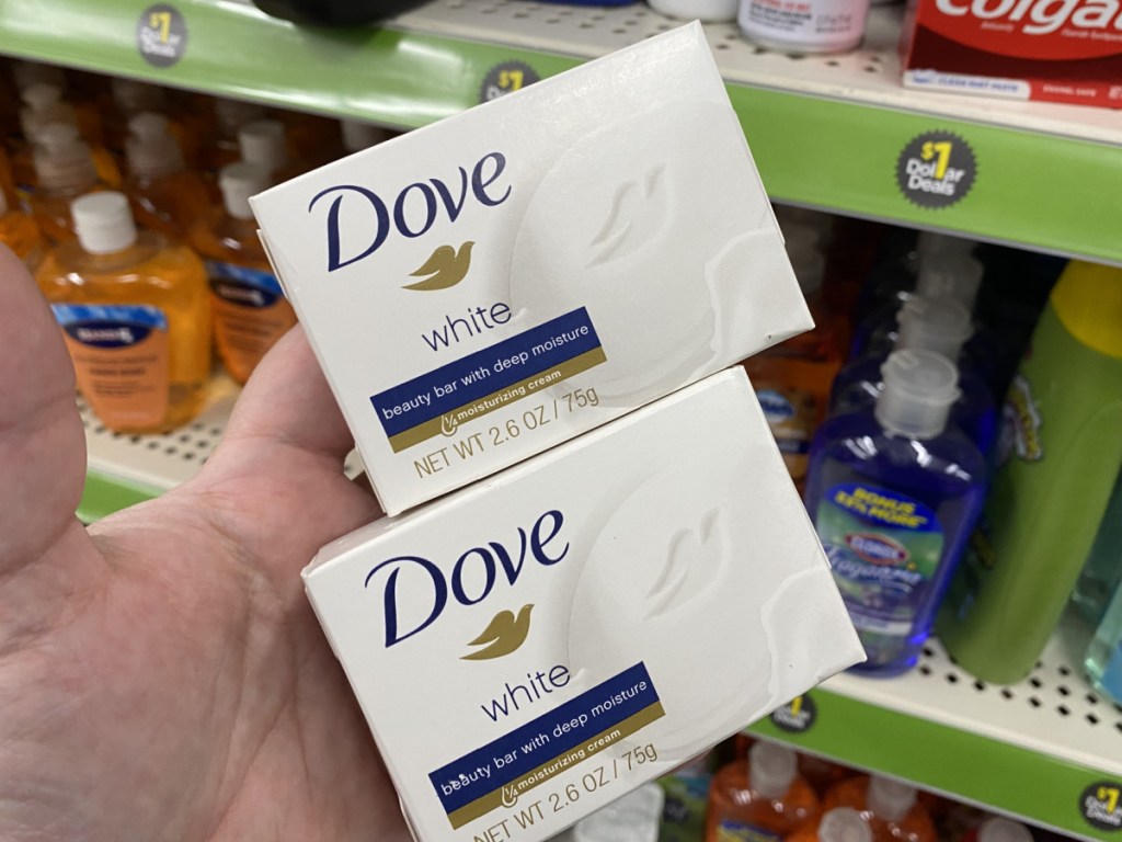 hand holding two bar soaps in store
