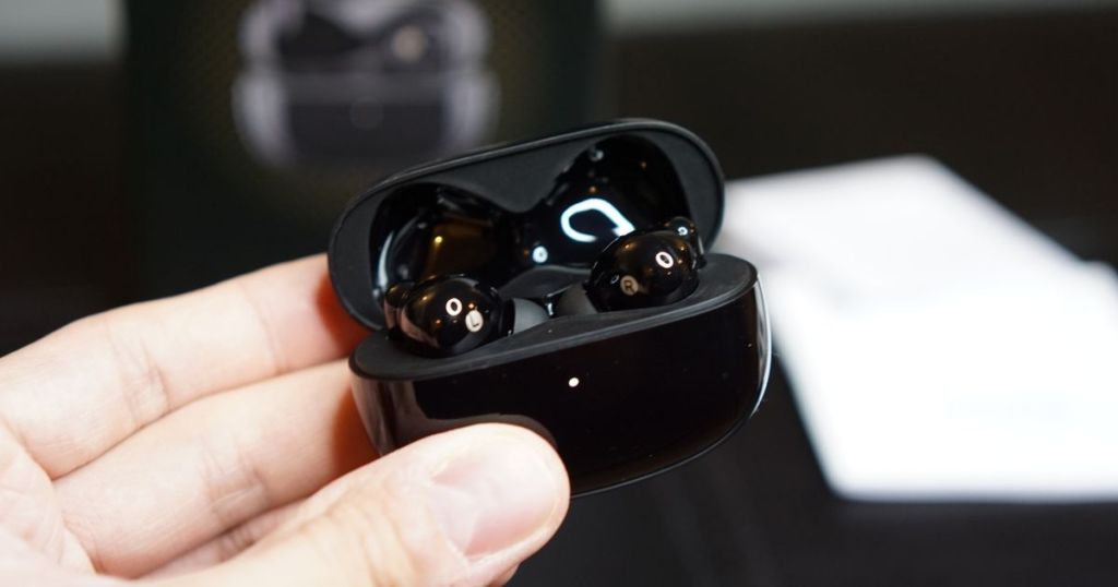hand holding black Edifier Noise Cancelling True Wireless Earbuds