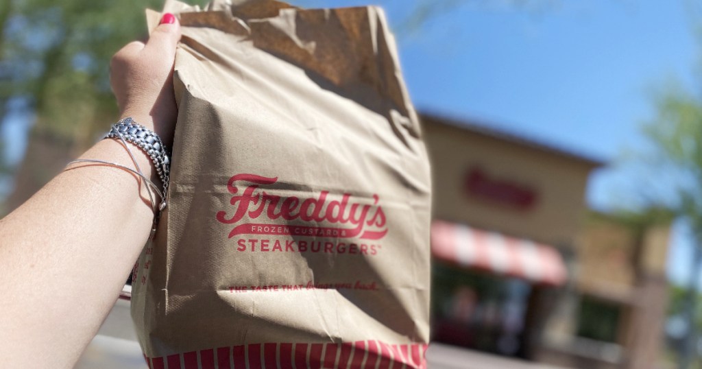 Freddy's to go bag in front of resturant