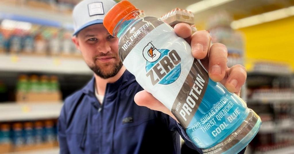 man holding Gatorade Zero with Protein 16.9oz bottle