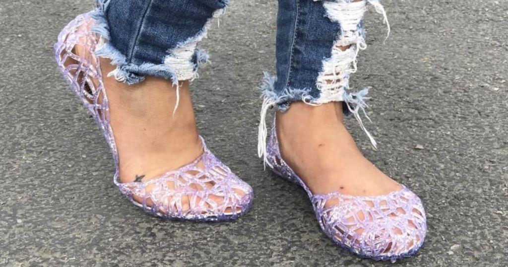 woman wearing glitter jelly shoes
