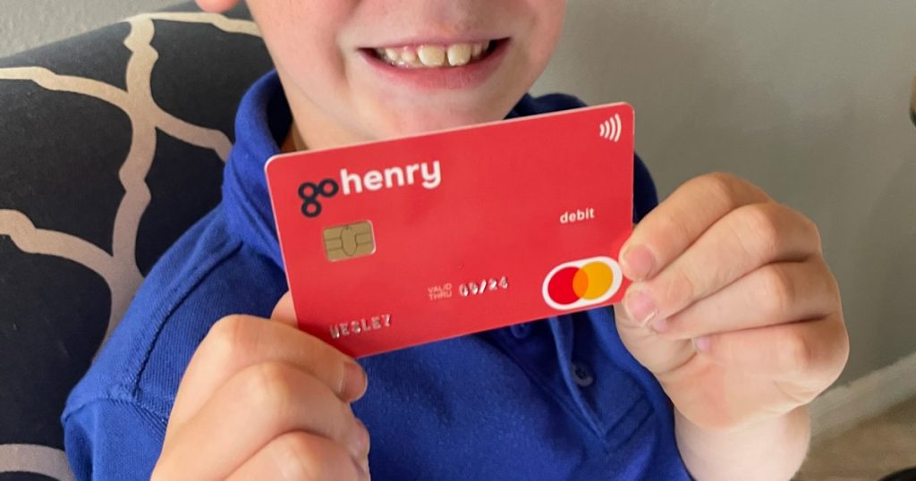 GoHenry Card being held by a little boy