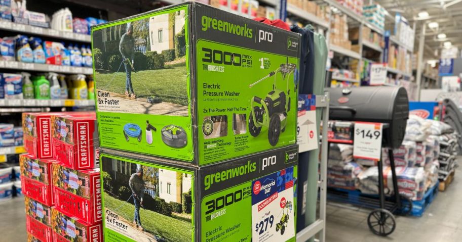 A Greenworks Pro 3000 PSI 2-Gallons Cold Water Pressure Washer in a box at the store