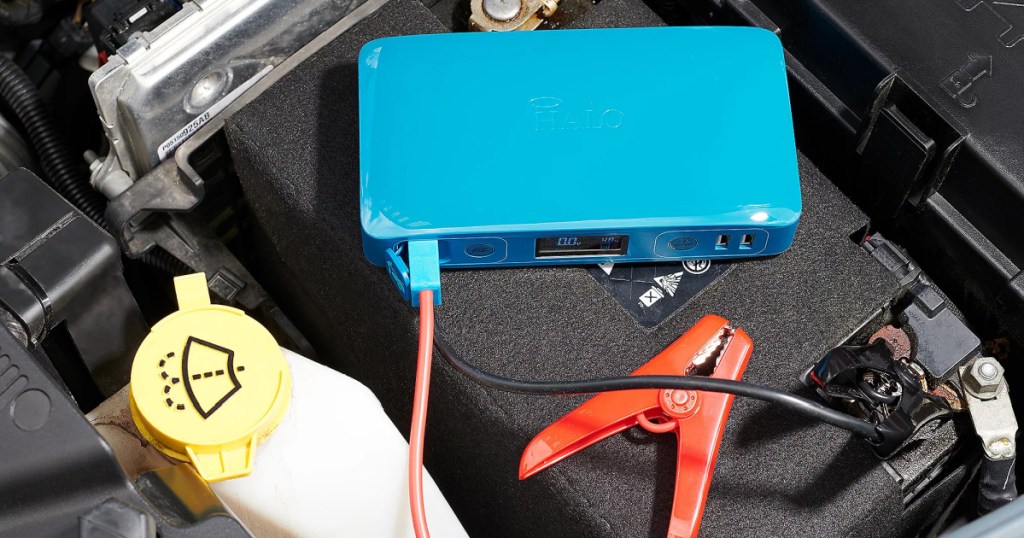 jump starter and cables in car