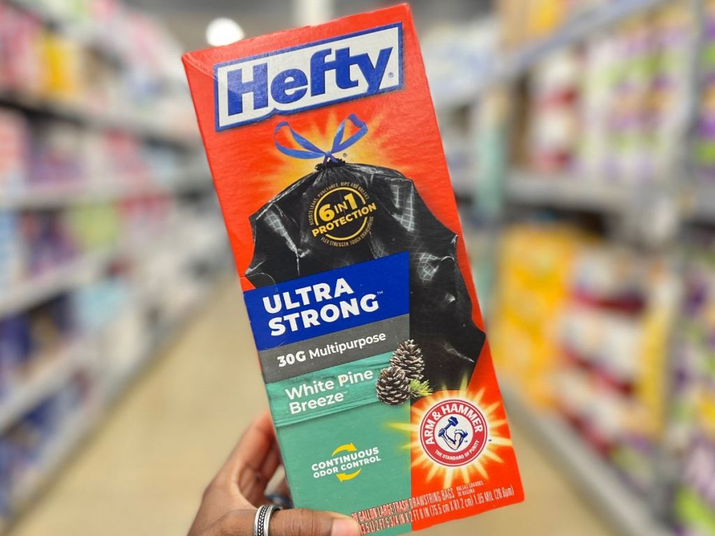 hand holding a box of Hefty Ultra Strong Trash Bags
