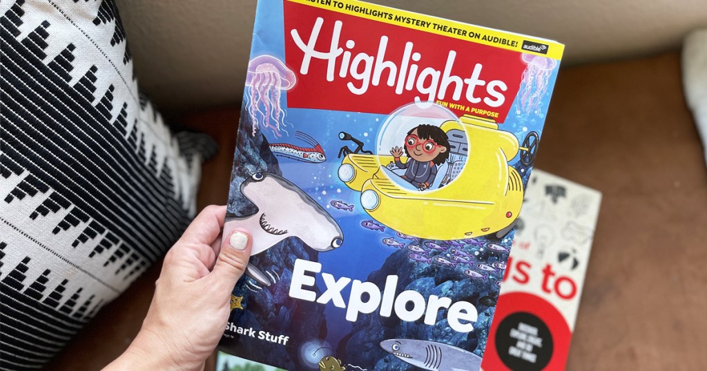 hand holding issue of highlights magazine