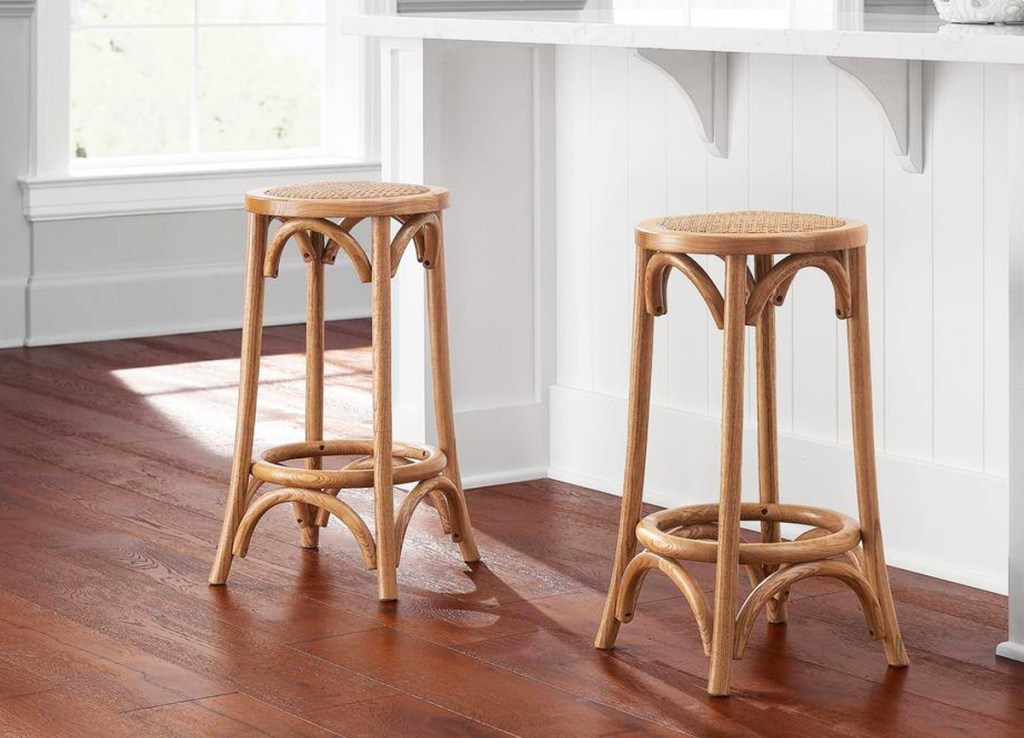 two round rood backless bar stools at counter