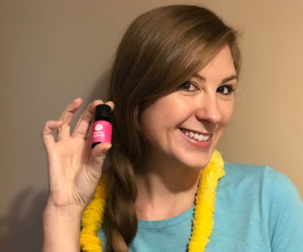 Woman Holding An Essential Oils Bottle
