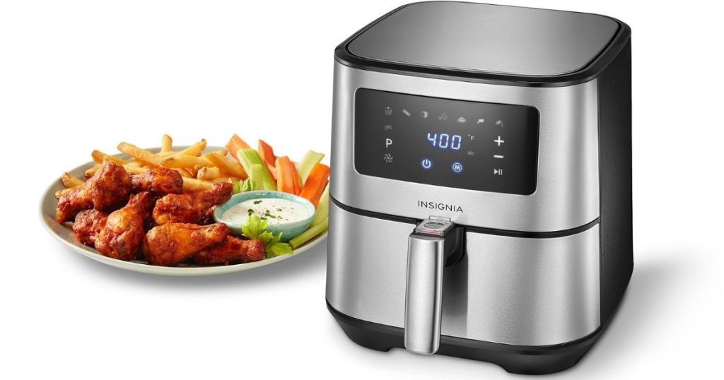 Insignia 5-Quart Digital Stainless Steel Air Fryer with plate of wings and fries next to it