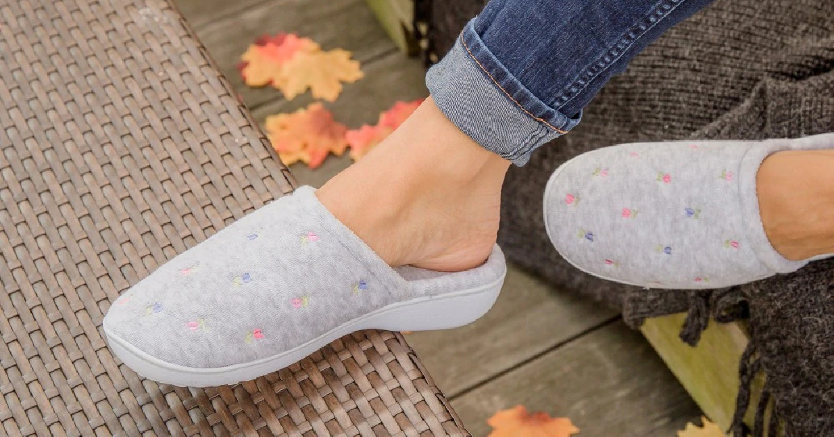 woman wearing gray floral print slippers outdoors