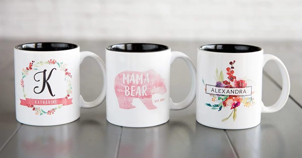 three personalized mugs