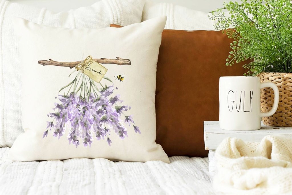 lavender throw pillow on bed