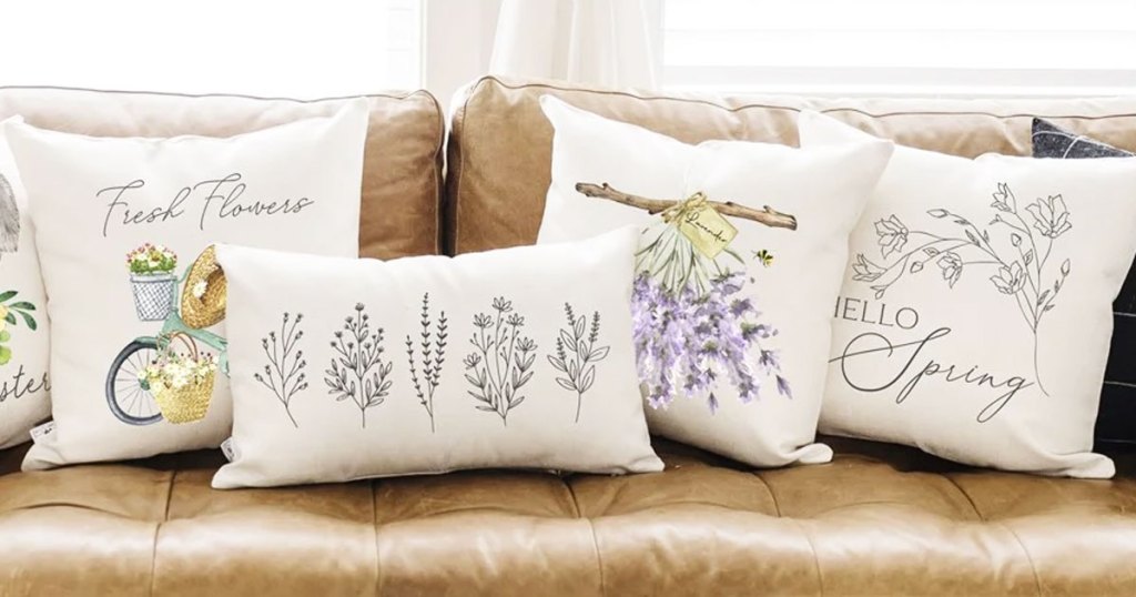 flower themed throw pillows on couch