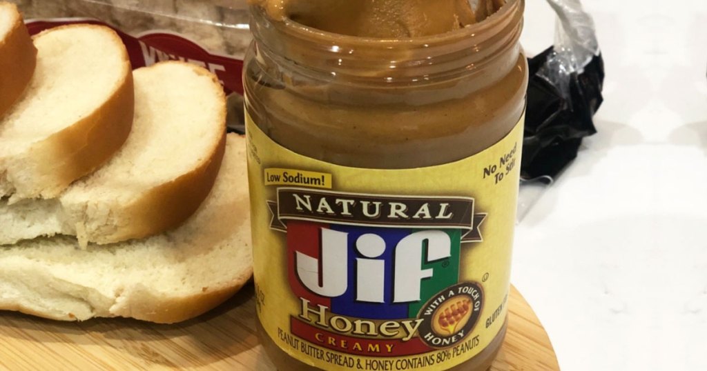 jar of jif peanut butter near bread