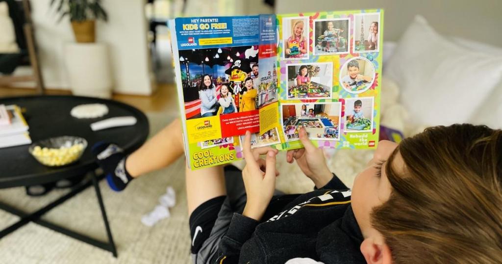 boy reading LEGO Life Magazine