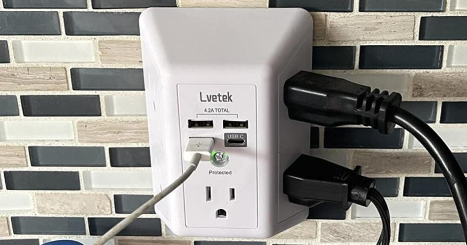 wall outlet extender in kitchen with multiple plugs