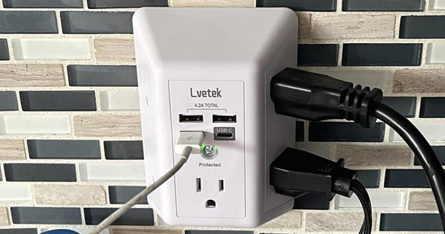 multiple cords plugged into an outlet extender